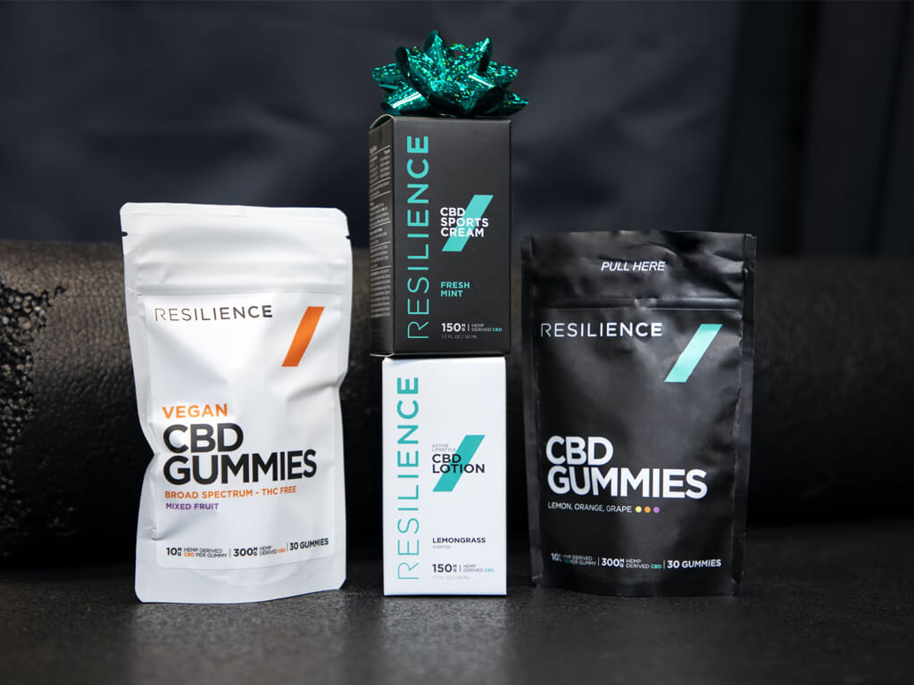 Cosmetic products including a jar, tube, and bottle with black and gold packaging