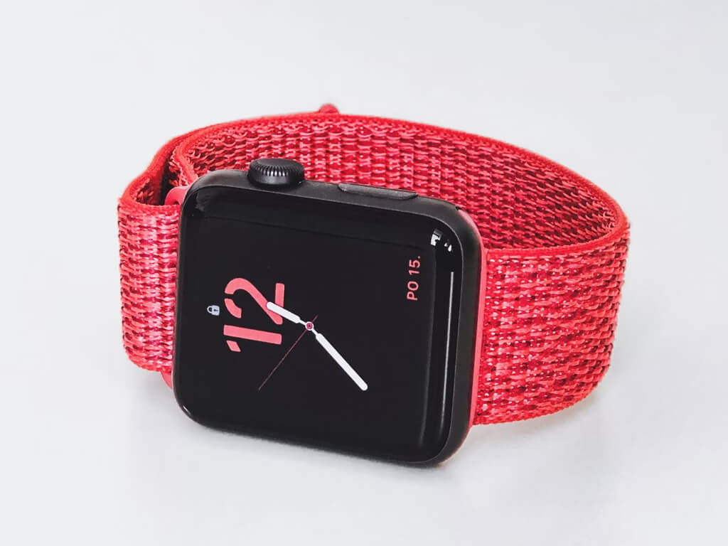 A hand holding a smartphone displaying a weather and analytics app