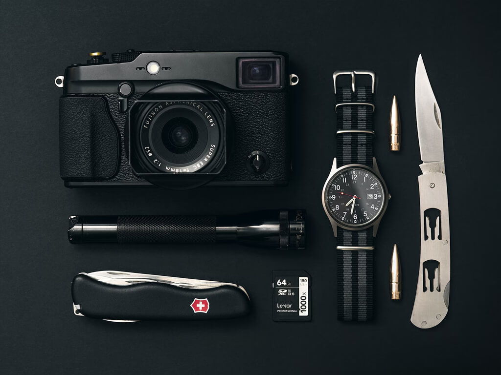 Cosmetic products including a jar, tube, and bottle with black and gold packaging